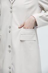 Beige long coat with multiple cut-outs