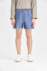 Graublaue Shorts mit geschwungenen Taschen